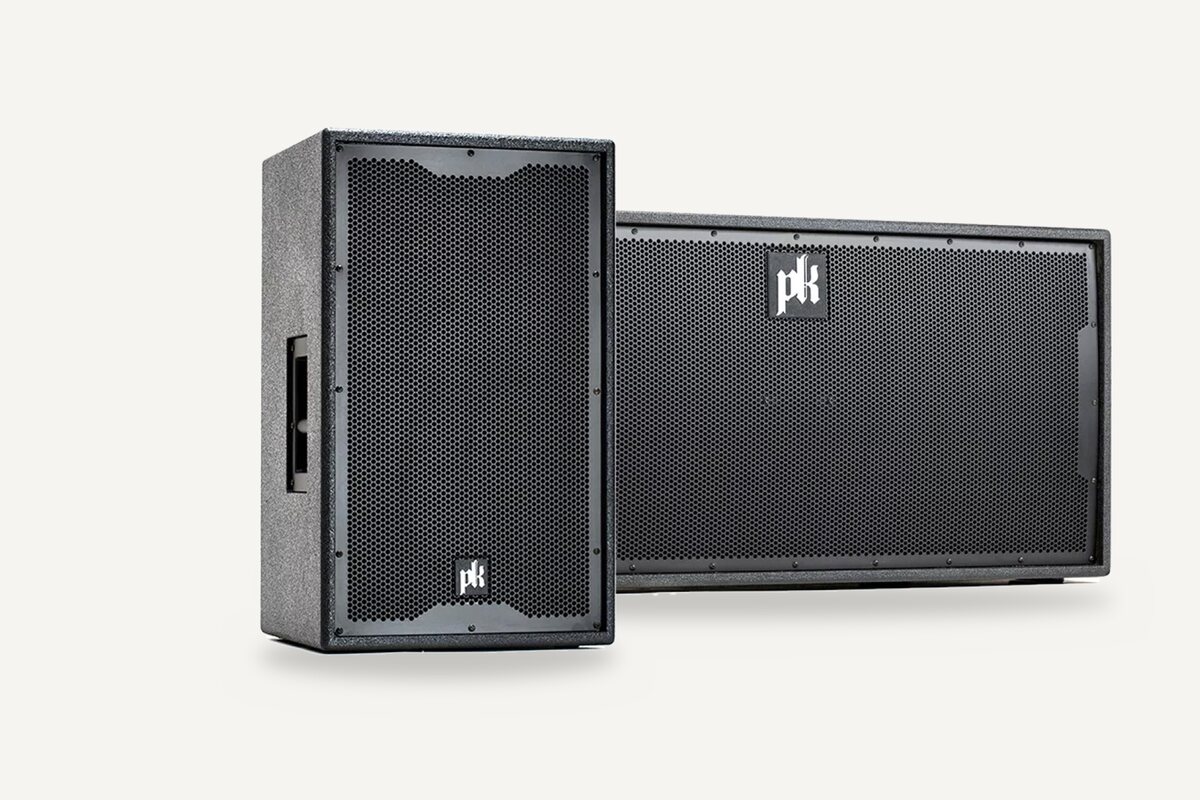 A PK Sound CX215 speaker in front of a CX800 subwoofer.