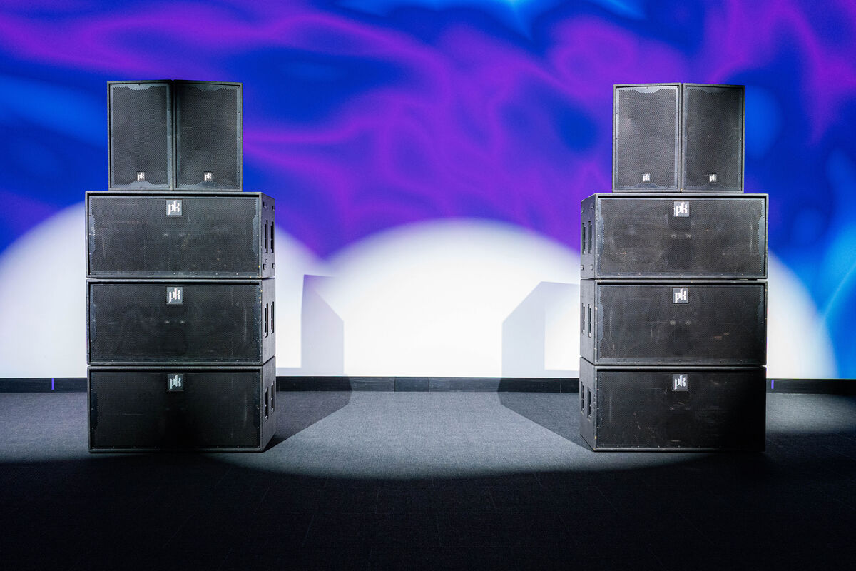 Two stacks, each three CX800 subwoofers high with a pair of CX215 tops on top.