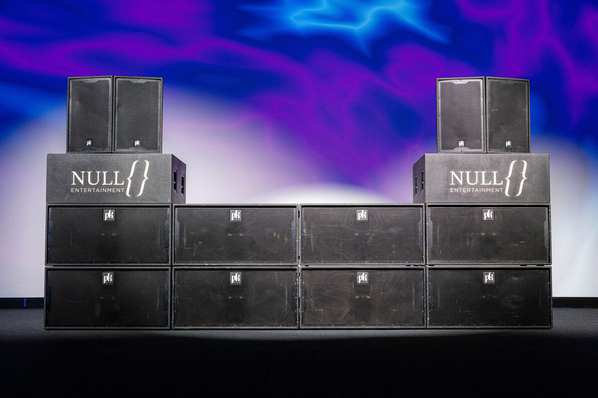 Eight CX800 subwoofers as a wall with four CX215 tops on risers.